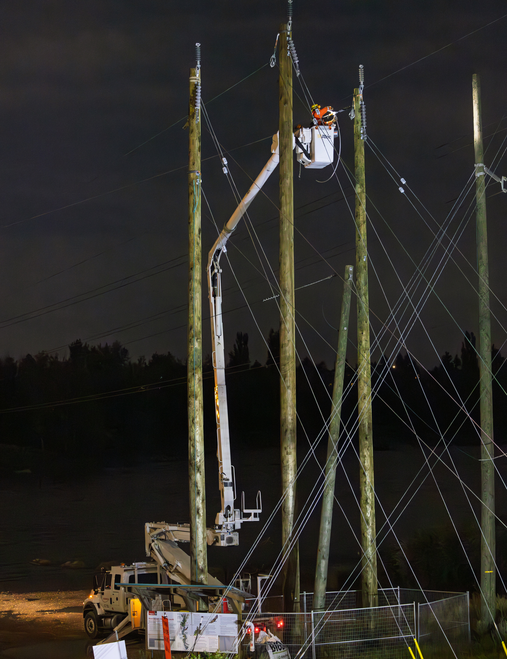 Stringing power lines across the Bow River