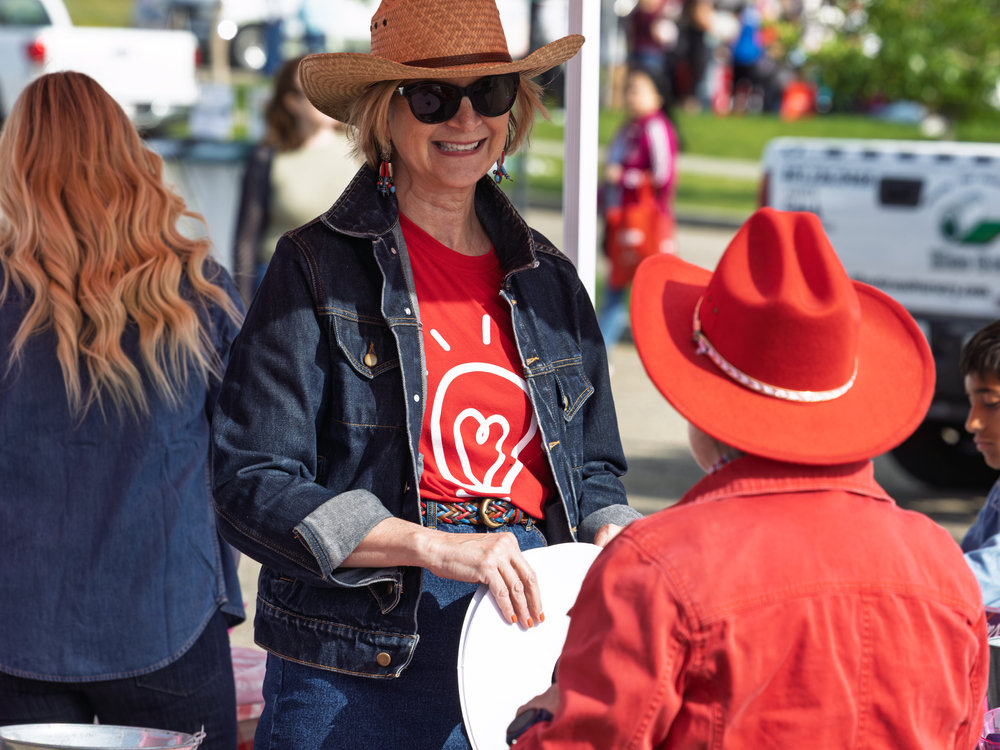 Greeting people at the Calgary Stampede Community Breakfast